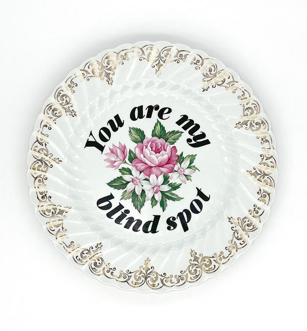 ceramic plates with words painted on them