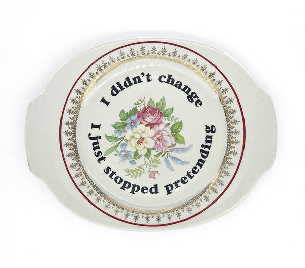 ceramic plates with words painted on them