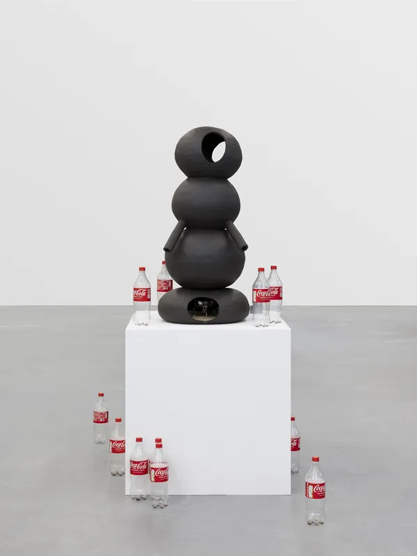 Yemo Park & Léo Luccioni Techno-Primitive Soft Moonshine Still, 2026 Glazed stoneware, sand, coca-cola bottles, butane gas approx. 95 x 40 cm. 37 3/8 x 15 3/4 in.