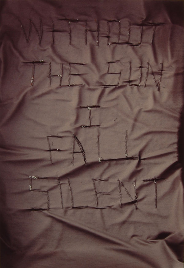 Black fabric with text in black, Without The Sun I Fall Silent