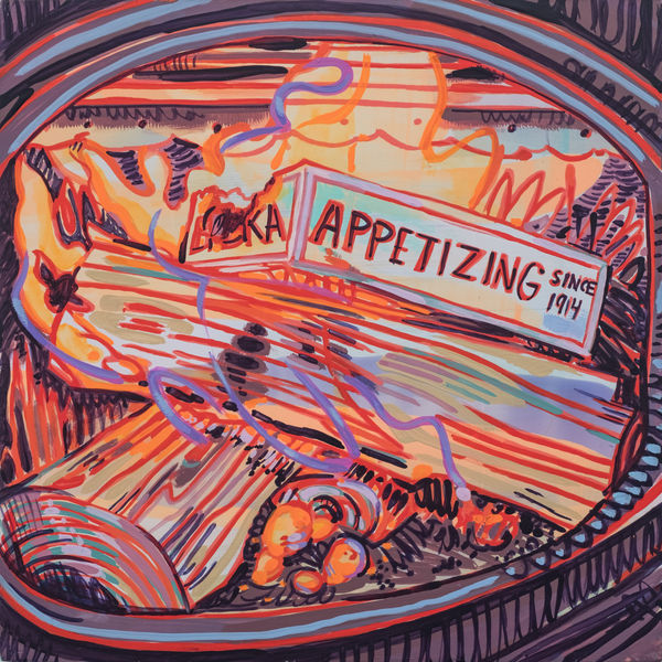 A burning pizza box in a fire pit