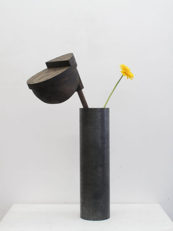 Oak Sculpture of a vase containing a yellow flower