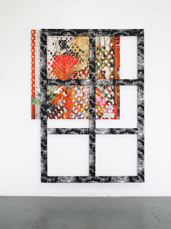 Stretcher bars covered in fabric installed over a smaller brightly colored fabric covered stretcher