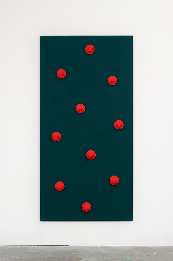 Green board with red circular objects