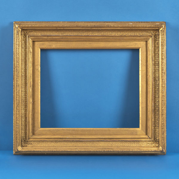 Scottish Daiper pattern hollow frame, 19th century gilt compo deep hollow with daiper pattern coverground ornament; mitre detail; leaf and berry top with mitre ribbons; ornate back edge; slip rebate size: 16.625 x 20.625 inches sight size: 15.875 x 19.75 inches width: 5.5 inches