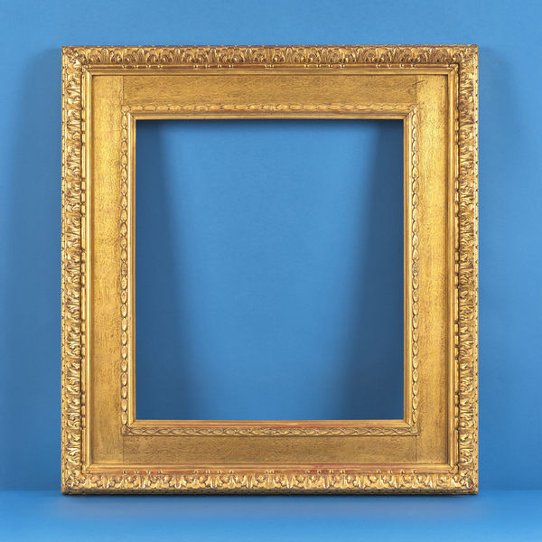 Watts frame, 19th century maker's label fragment for R. Dolman & Son, 6 New Compton Street, Soho, London butt jointed, oil gilded oak frieze with applied composition ornament front and back rebate size: 23.75 x 21.25 inches sight size: 23 x 20.5 inches width: 5.75 inches