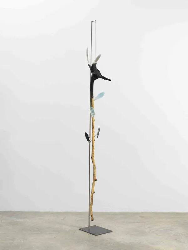 Minouk Lim (b. 1968) Mother Tongue, 2022 Wood cane, polyurethane resin, metal plate Dimensions: 75 1/2 x 10 1/2 x 8 inches 191.8 x 26.7 x 20.3 cm Metal Plate Dimensions: 11 7/8 x 9 1/8 inches 30 x 23 cm Stand Dimensions: 90 5/8 inches 230 cm