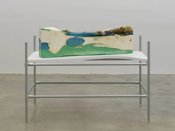 Minouk Lim (b. 1968) Dudu Mulmul No. 32, 2021 Epoxy resin, urethane, plaster, agar, partially eaten waffle, piece of photograph, earphones, LED bulb, arm warmer, electrical wire, kangaroo skull Dimensions: 10 5/8 x 52 3/4 x 15 3/4 inches 27 x 134 x 40 cm