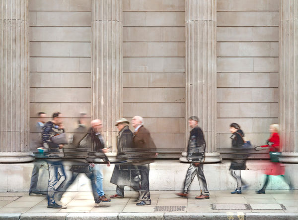 People walking by the Bank of England