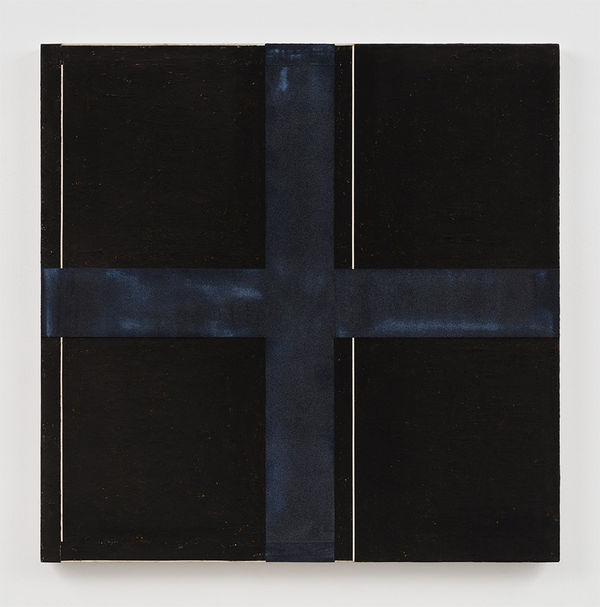 A square canvas is covered in black acrylic paint and divided into four equal parts by a black cross consisting of paint and crushed glass. Two vertical thin white lines run paralell to one another down the center of the canvas and along its left edge.