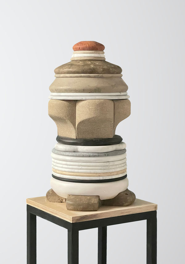 Medium-sized sculpture comprising layers of foliated marble and stone of varying color and thickness