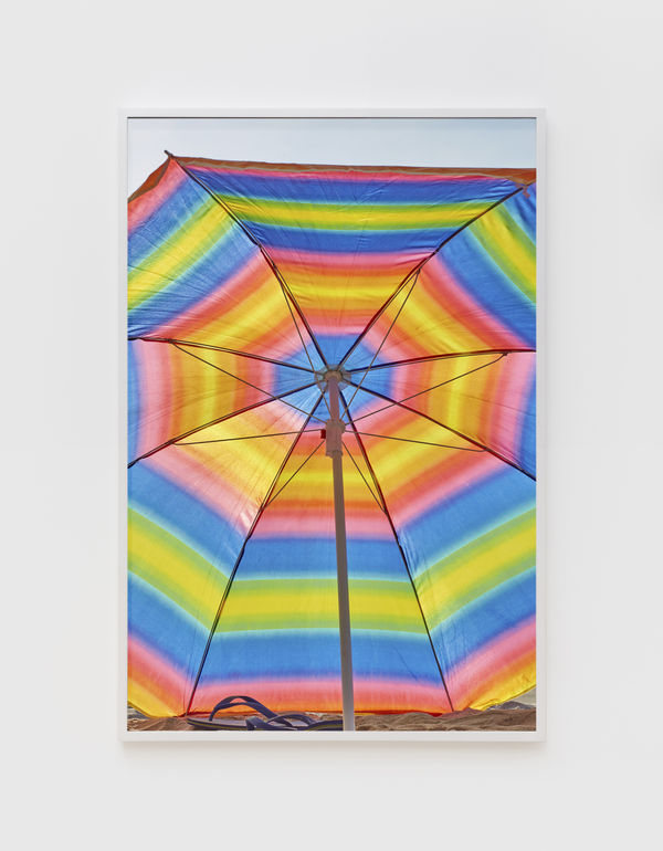 Roe Ethridge Rainbow Beach Umbrella with Flip Flops, 2020 Dye sublimation print on aluminum 60 x 40 inches (152.4 x 101.6 cm.) Edition of 5 plus 2 artist's proofs