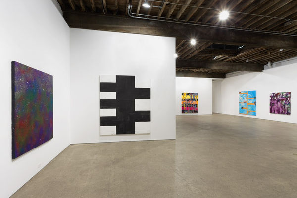 Installation view of Chris Martin's first solo show at Anton Kern Gallery, featuring a select few paintings from a summer of working in Upstate New York. Entry into the gallery. Few works shown,