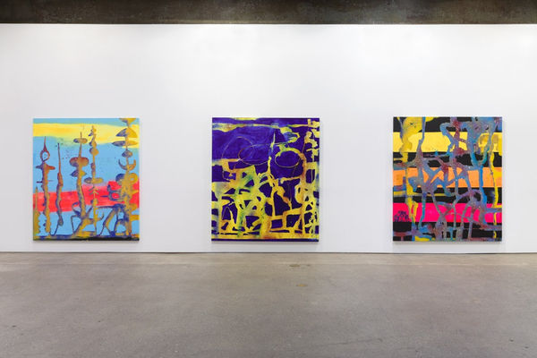 Installation view of Chris Martin's first solo show at Anton Kern Gallery, featuring a select few paintings from a summer of working in Upstate New York. Three of Martin's ethereal landscapes.