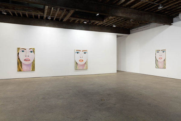 Installation view of Brian Calvin's fourth show at Anton Kern Gallery, featuring a group of paintings of faces, lips, mouths, poses, and a mirror. A few works shown.