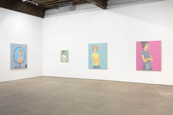 Installation view of Brian Calvin's fourth show at Anton Kern Gallery, featuring a group of paintings of faces, lips, mouths, poses, and a mirror. Some additional works.