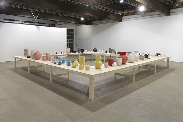 Installation view of Shio Kusaka's second show at Anton Kern Gallery, featuring a large collection of unique porcelain pots.
