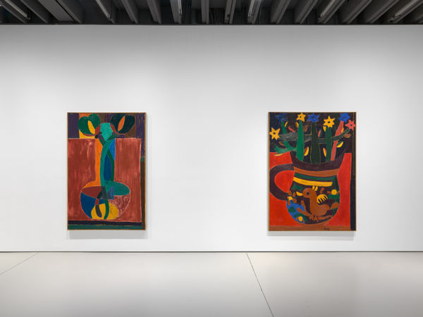 Installation view of Tal R's first exhibition with the gallery featuring two paintings.