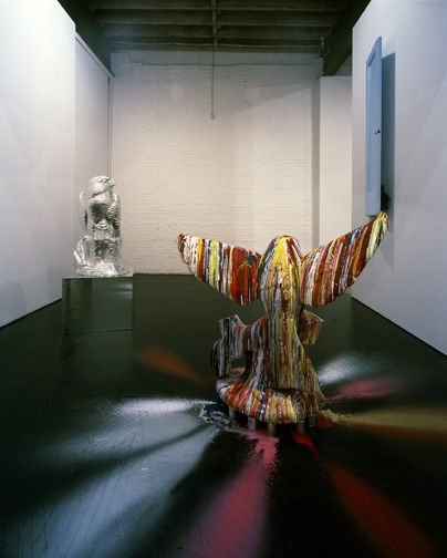 Installation view of Jim Lambie's solo show entitled Byrds, featuring three sculptures. The backs of two works.