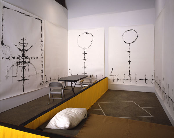 Installation view of Matt Mullican's One Night Performance featuring the artist "under-hypnosis."