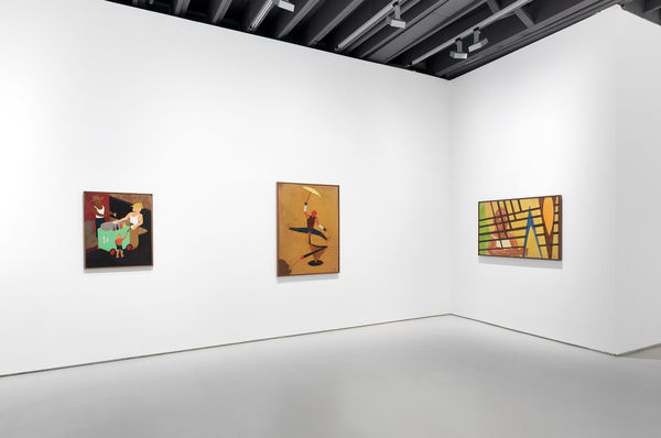 Separate corner view including three total paintings.