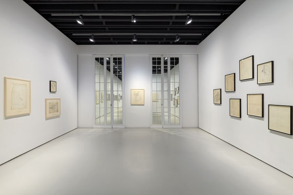Installation view of Andy Warhol drawings from the 1950's. A few more drawings presented. French doors frame one of Warhol's larger drawings of the set.