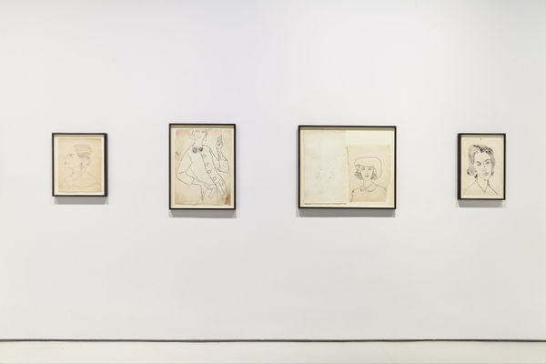Installation view of Andy Warhol drawings from the 1950's. Two drawings shown.