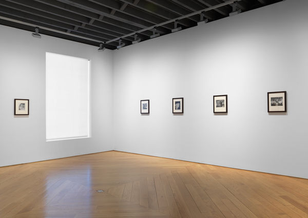 Installation view of vintage Weegee photos.