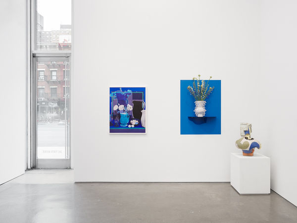 Installation View | RGB: John Gill, Daniel Gordon, Emily Mullin, Ettore Sottsass  Daniel Gordon (American, b. 1980)  Blue Still Life with White Peonies, Eggs and Onions, 2019  Pigment Print with UV Lamination  37 1/2" x 29 3/4" (95 x 75.5 cm)  Edition of 3 plus 1 artist's proof  Emily Mullin (American, b. 1984)  Ettore, 2022  Porcelain Vessel, Powder Coated Steel, Flora  21" x 19" x 9 1/4" (53.5 x 48.5 x 23.5 cm)  (Floral Dimensions Variable)  (EMul.23315)  John Gill (American, b. 1949)  Vase, 2021  Ceramic  Approximately 25” x 19” x 19” (63.5 x 48.5 x 48.5 cm)  (JG.22964)