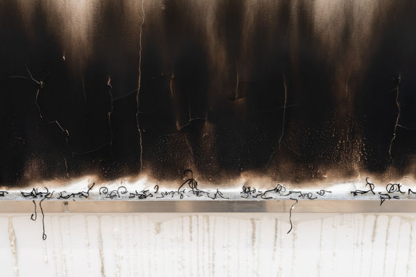 The Broken Burned Kilometer, 2025, Aluminum shelf, candle and fire on wall, Variable dimensions.