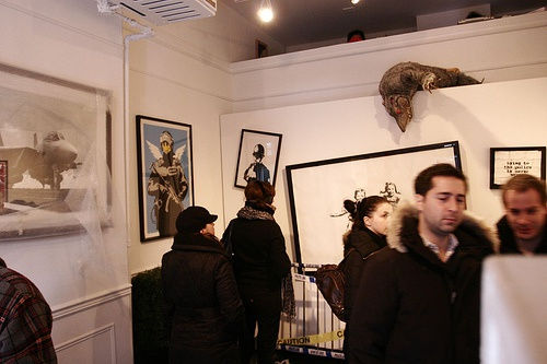Banksy artworks hanging on wall