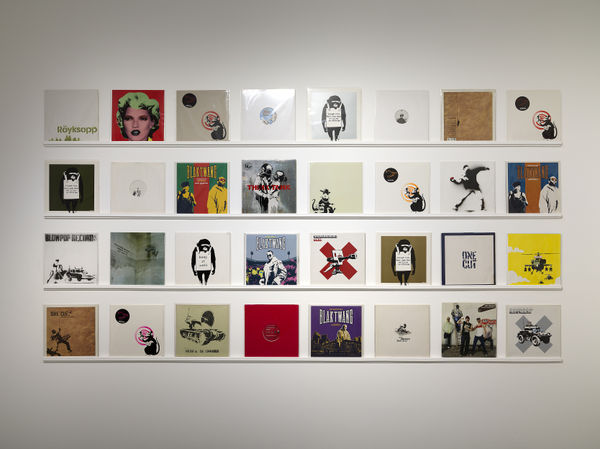 Banksy artworks hanging on wall