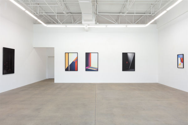 installation view of photographs by Popel Coumou