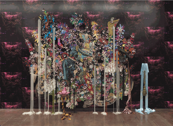  Ebony G. Patterson, ...in the lament...there is a nest...a bursting  a...nourishing, 2021-2022, Hand-cut jacquard woven photo tapestry with appliqué, fabric, trim, feathers, beads, resin, glitter, wood, steel, and plastic mounted on wallpaper, 294.6 x 37