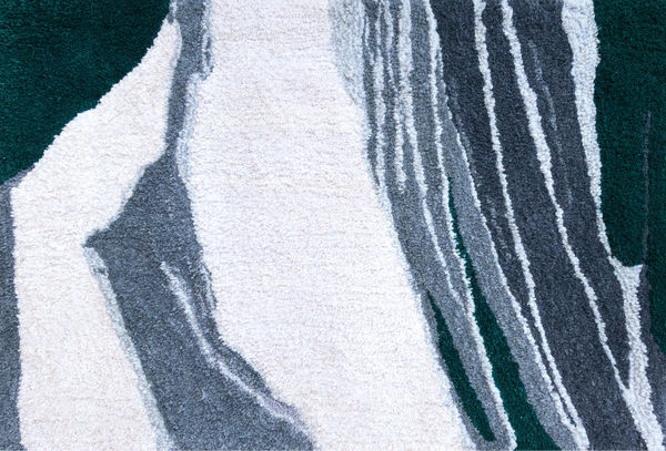 Hand tufted rug of muted abstract landscape