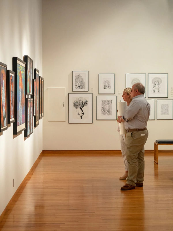 two guests at Chuck Sperry exhibition