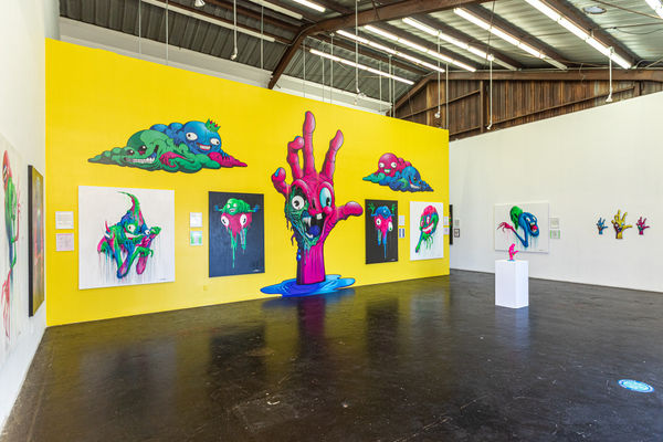 Install photo of brightly colored Alex Pardee exhibition