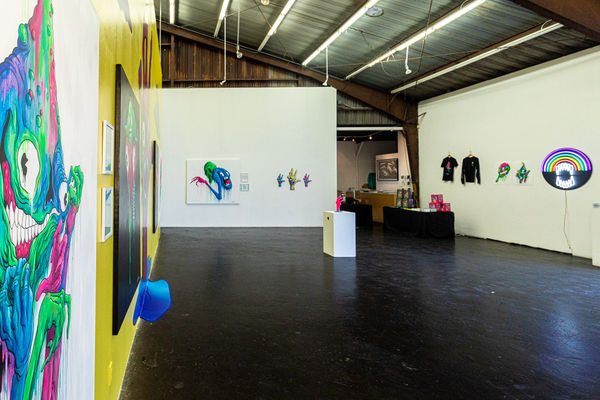 Install photo of brightly colored Alex Pardee exhibition