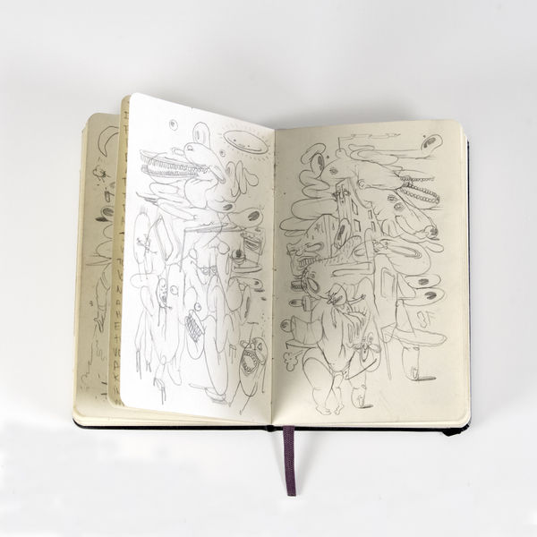scratchy abstract illustrations inside of a notebook