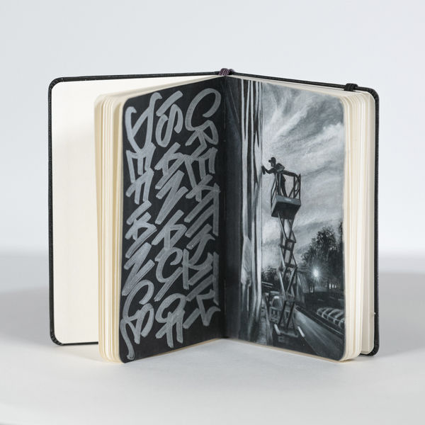 Black and White illustration inside of a Moleskine notebook