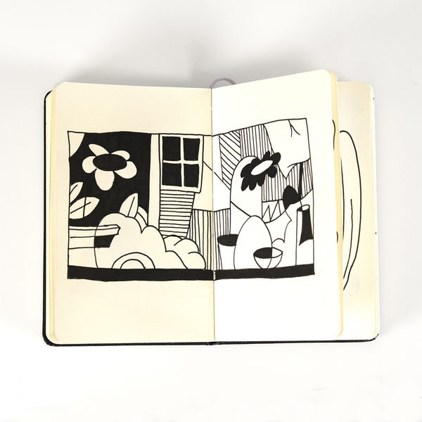 black and white drawing of flowers in a house made in a moleskin notebook