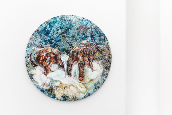 Tondo showing hands with cotton by Cameroonian painter Jean David Nkot at AFIKARIS Gallery Paris shot by Studio Vanssay