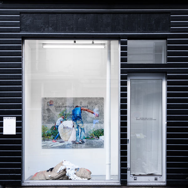 Contemporary African art gallery AFIKARIS' window at 7 rue Notre-Dame-de-Nazareth in Paris showing a work by Jean David Nkot