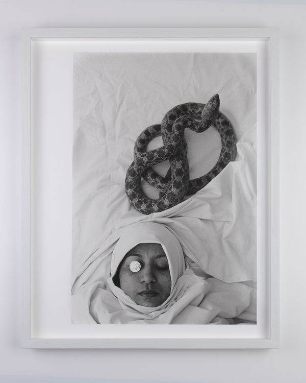 George Hallett : Lorna de Smidt posing for the cover of I.N.C. Aniebo’s Of Wives, Talismans and the Dead. London: 1980's (CF-GH-3540)