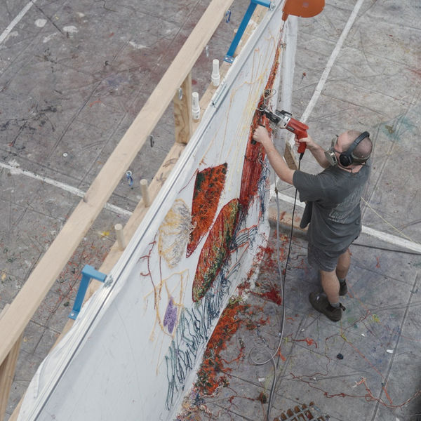 Image of Australian artist Gene A'Hern working in his studio.