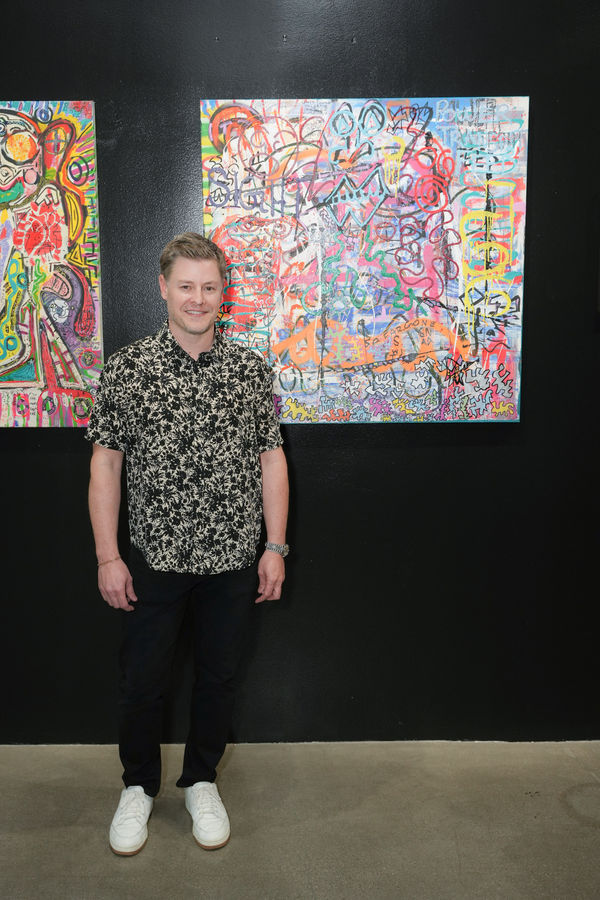 Photo 54 Kipton Cronkite Standing In Front Of Paris Brosnan S Paintings