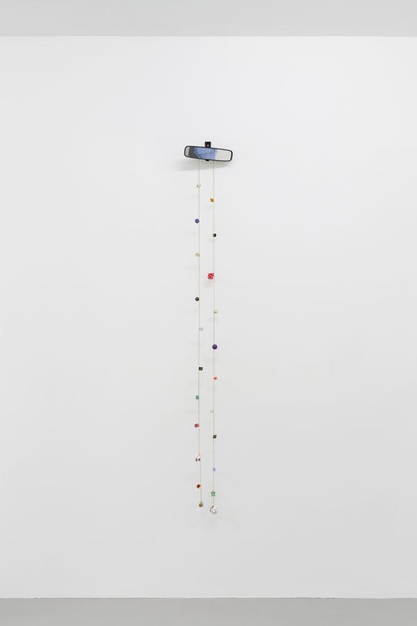 Cassidy Toner, Hindsight is 20/20 #2, 2020-2021, car mirror, dice, brass and chain, 170 x 24 x 6 cm