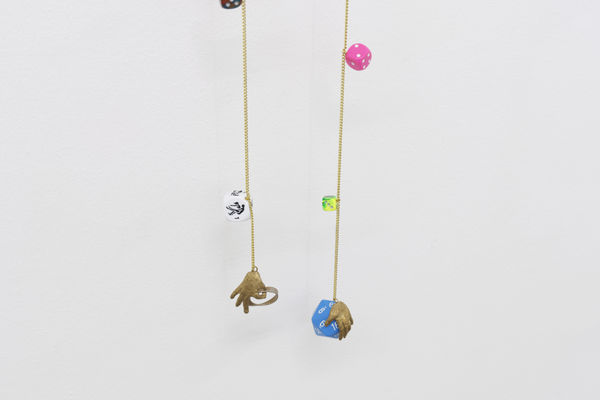 Detail, Cassidy Toner, Hindsight is 20/20 #3, 2020-2021, car mirror, dice, brass and chain, 160 x 24 x 6 cm