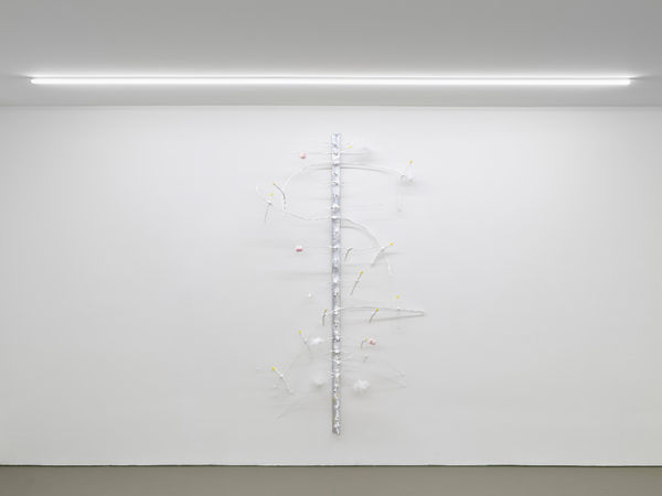 Chandelier of Mating Season, 2025, aluminum, wire, plaster, collagen, feather, marshmallow, gelatine, acrylic, wood, fire, 160 x 20 x 60 cm