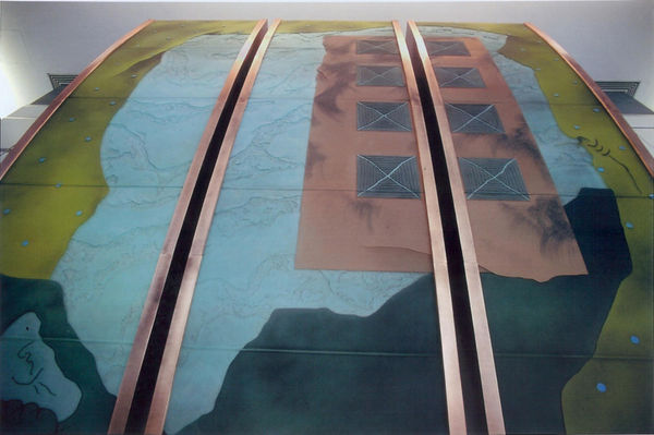 Large dichroic glass sculpture seen from below